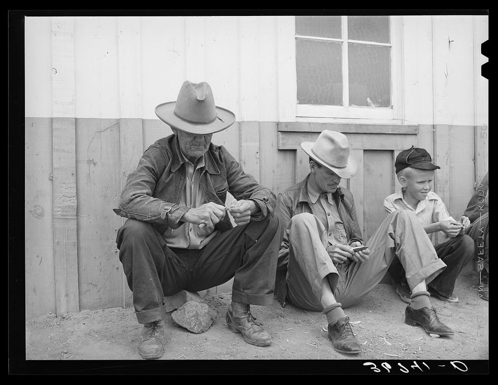 Farmers whittling. Pie Town, New Mexico by Russell Lee