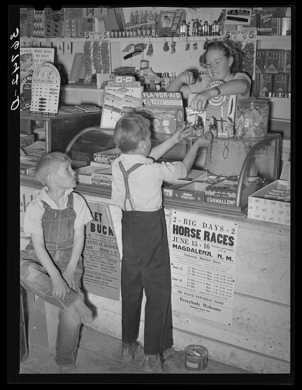 Farm children buying candy at the general store at Pie Town, New Mexico by Russell Lee