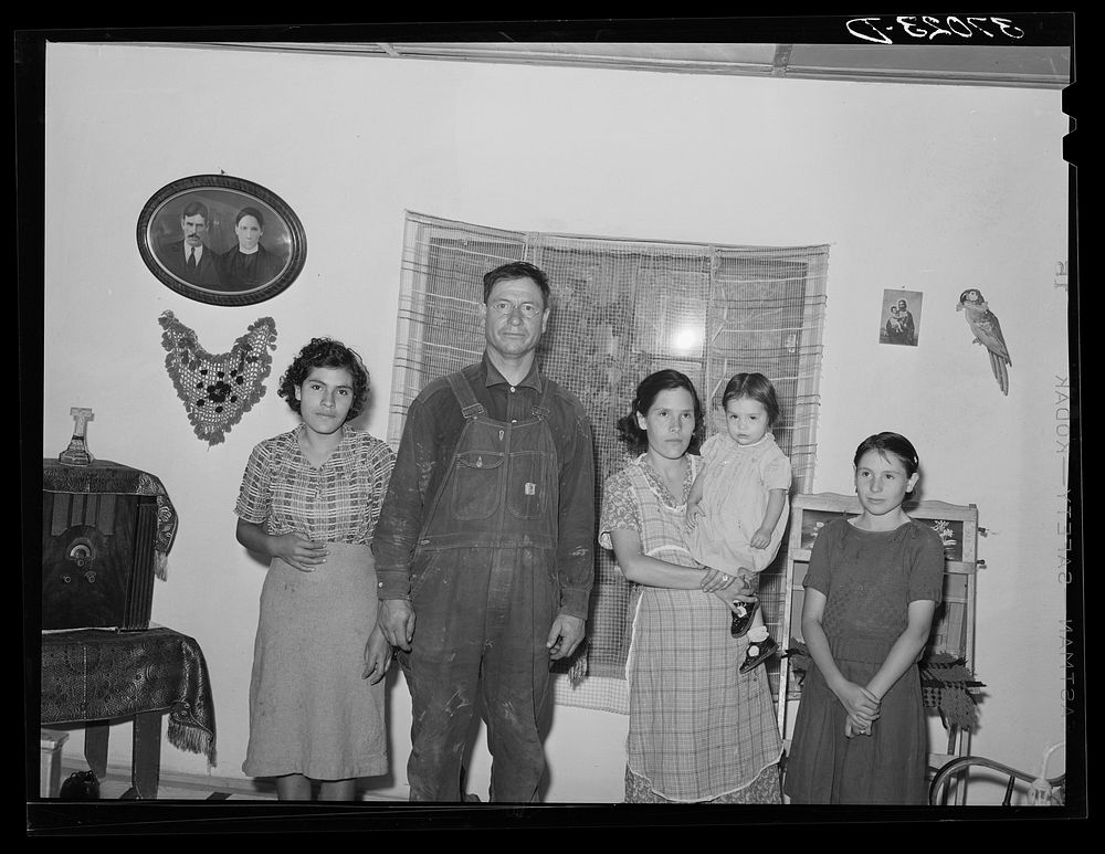 Spanish-American farmer and his family, Chamisal, New Mexico by Russell Lee