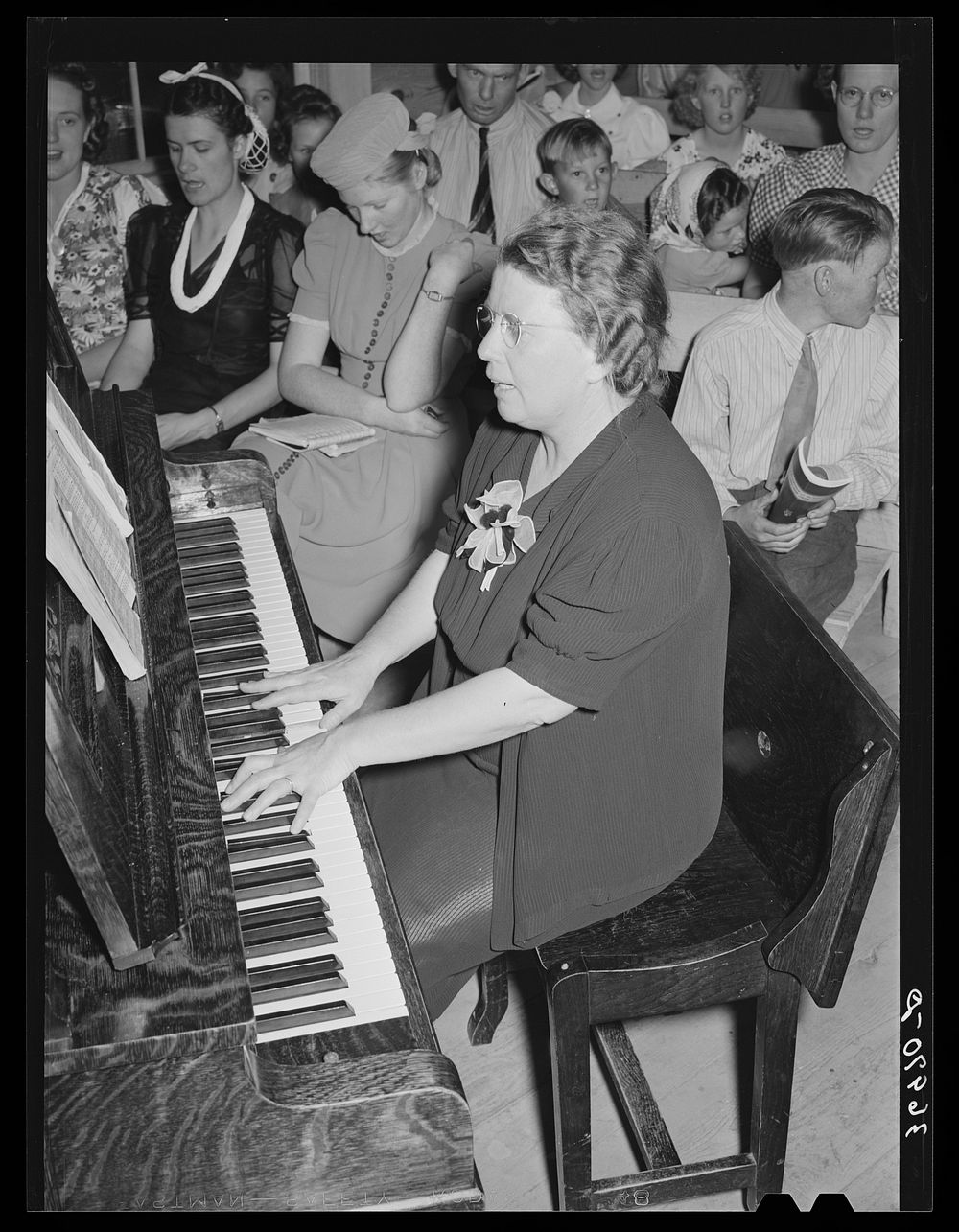 Pianist at community sing. Pie Town, New Mexico. She and her husband were one of the first homesteaders by Russell Lee