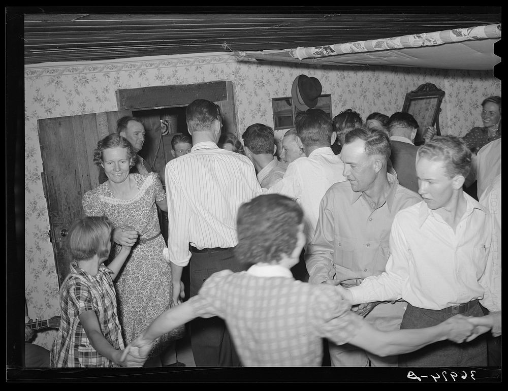 Dancing the Paul Jones at square dance. Pie Town, New Mexico by Russell Lee