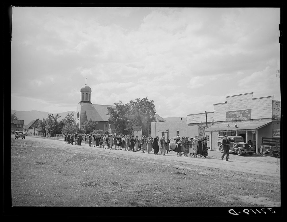Procession of Spanish-American Catholics in honor of a saint. Penasco, New Mexico by Russell Lee
