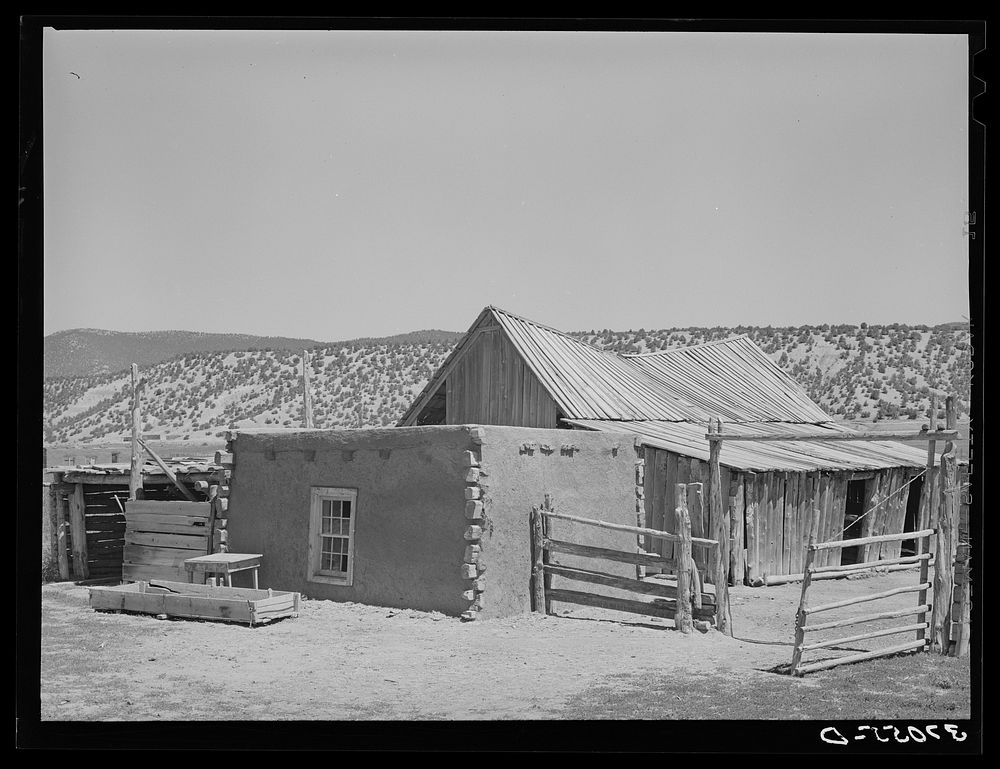 Adobe shed and barn of Spanish-American. Chamisal, New Mexico by Russell Lee