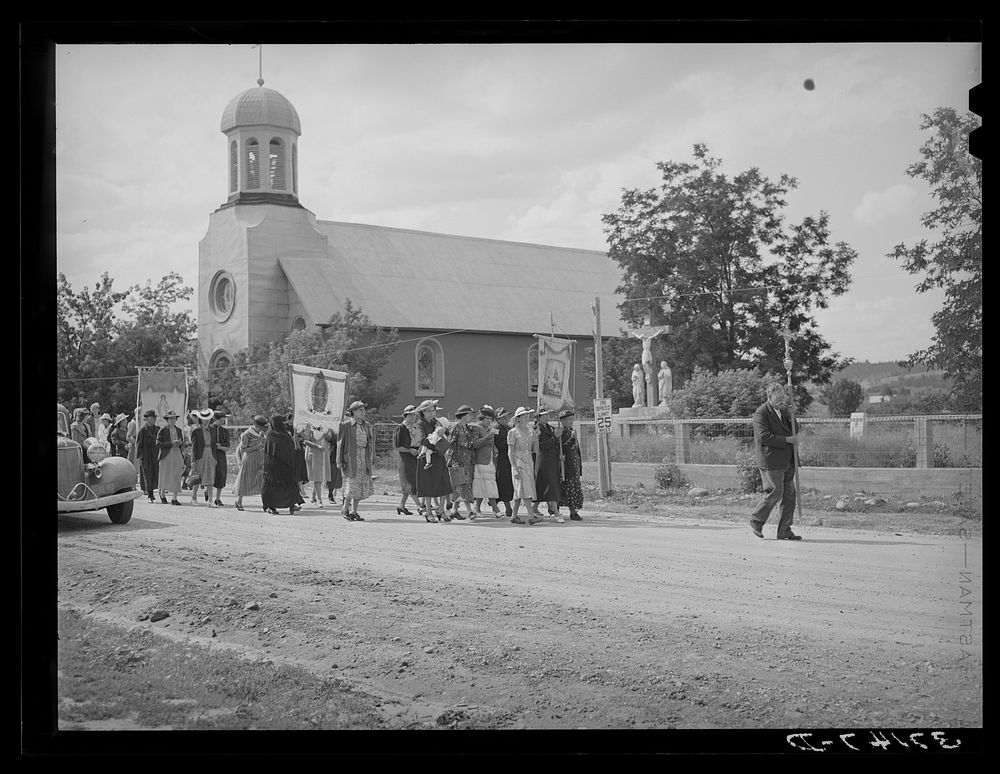 Procession of Spanish-American Catholics to honor a saint. Penasco, New Mexico by Russell Lee