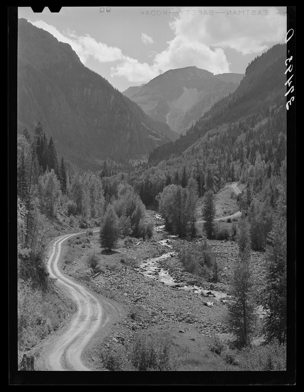 [Untitled photo, possibly related to: Mountain stream and road. Ouray County, Colorado] by Russell Lee