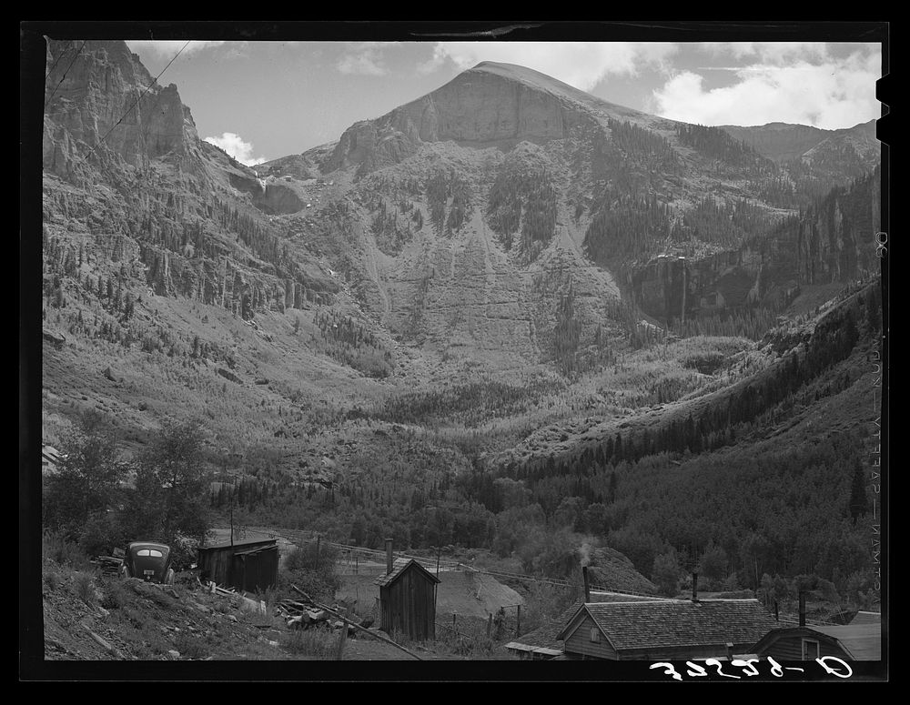 [Untitled photo, possibly related to: End of mountain valley near Telluride, Colorado, showing road up to mine and Bridal…