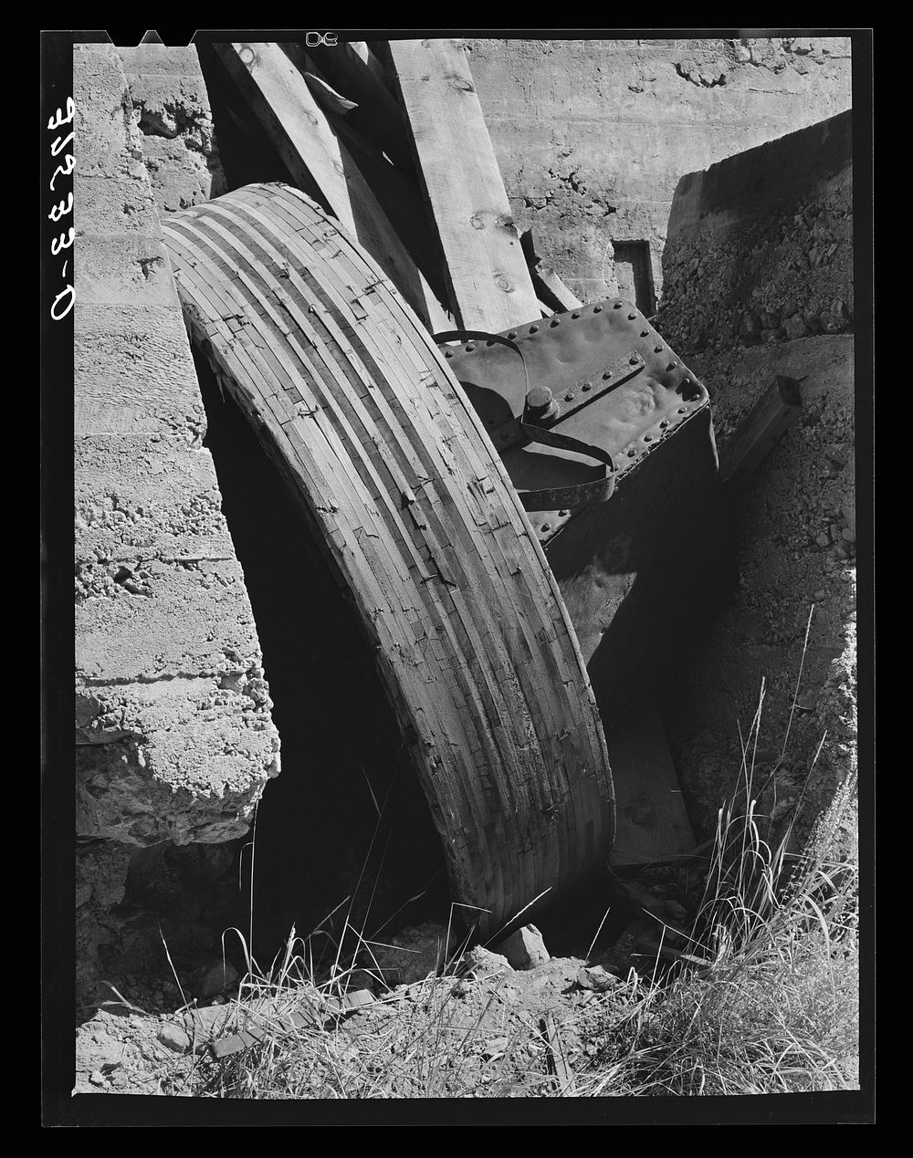 [Untitled photo, possibly related to: Abandoned equipment at gold mill showing laminated wooden wheels. Telluride, Colorado]…