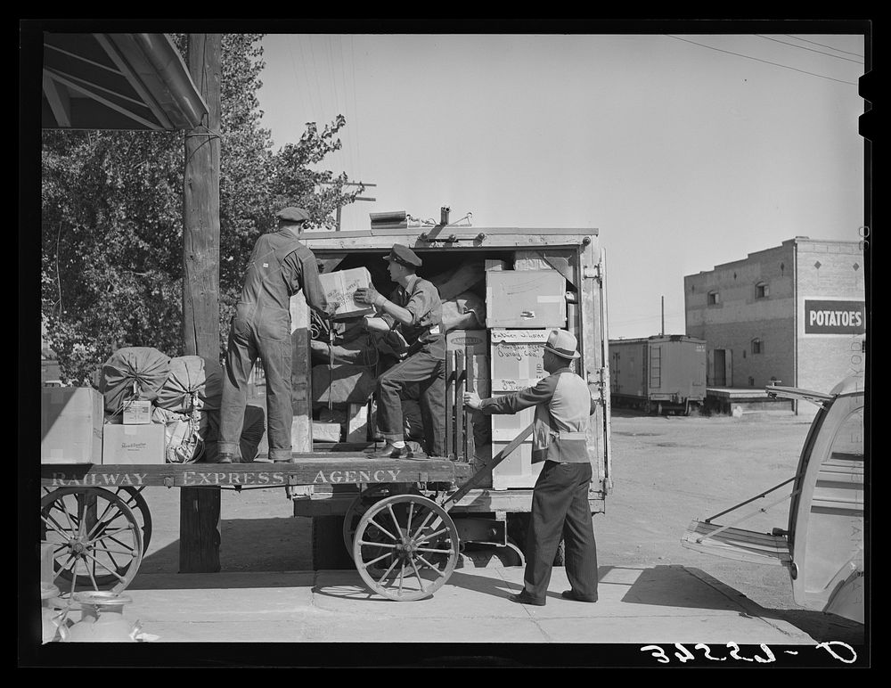 Loading express packages into D. & R.G.W. truck which takes them to points on the narrow gauge railroad where passengers and…