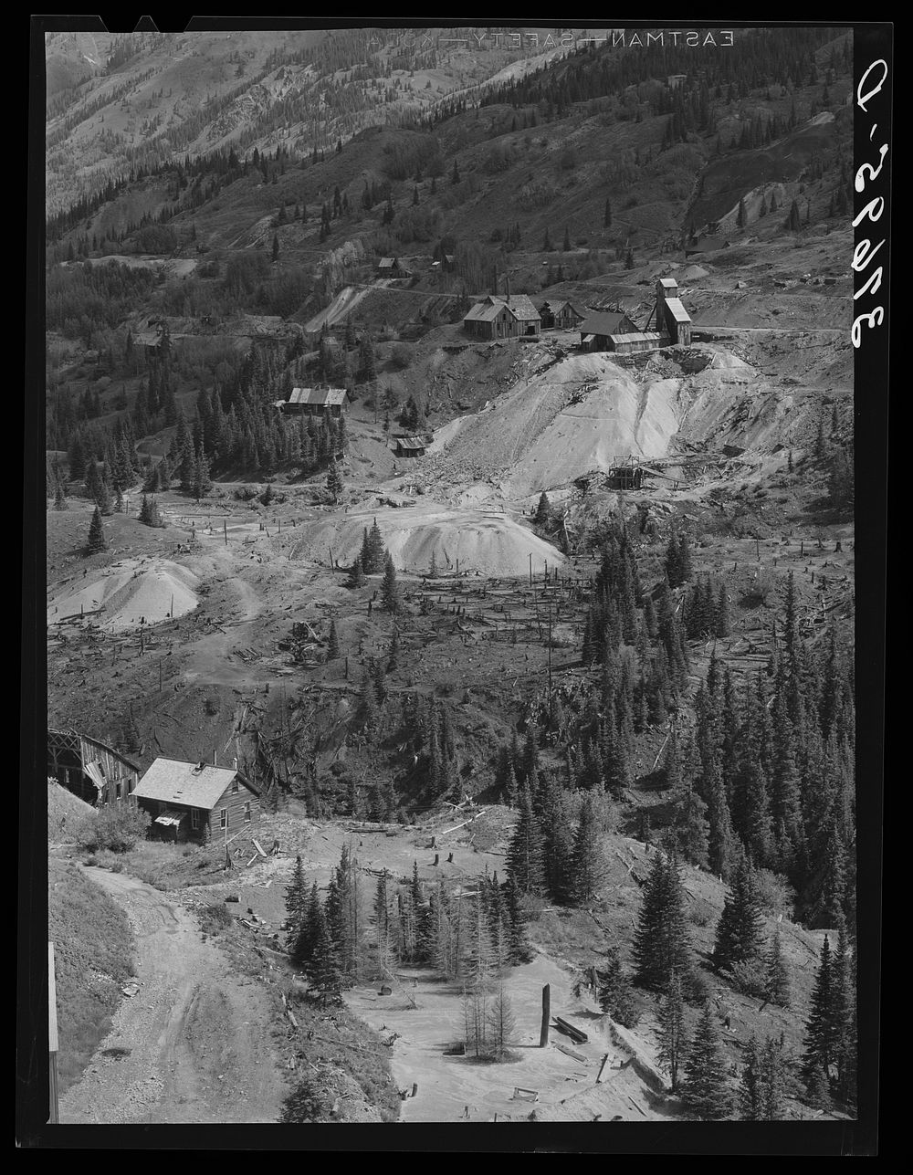 Abandoned gold mines and mills with piles of tailings in San Juan County, Colorado. The results of excessive cutting of…