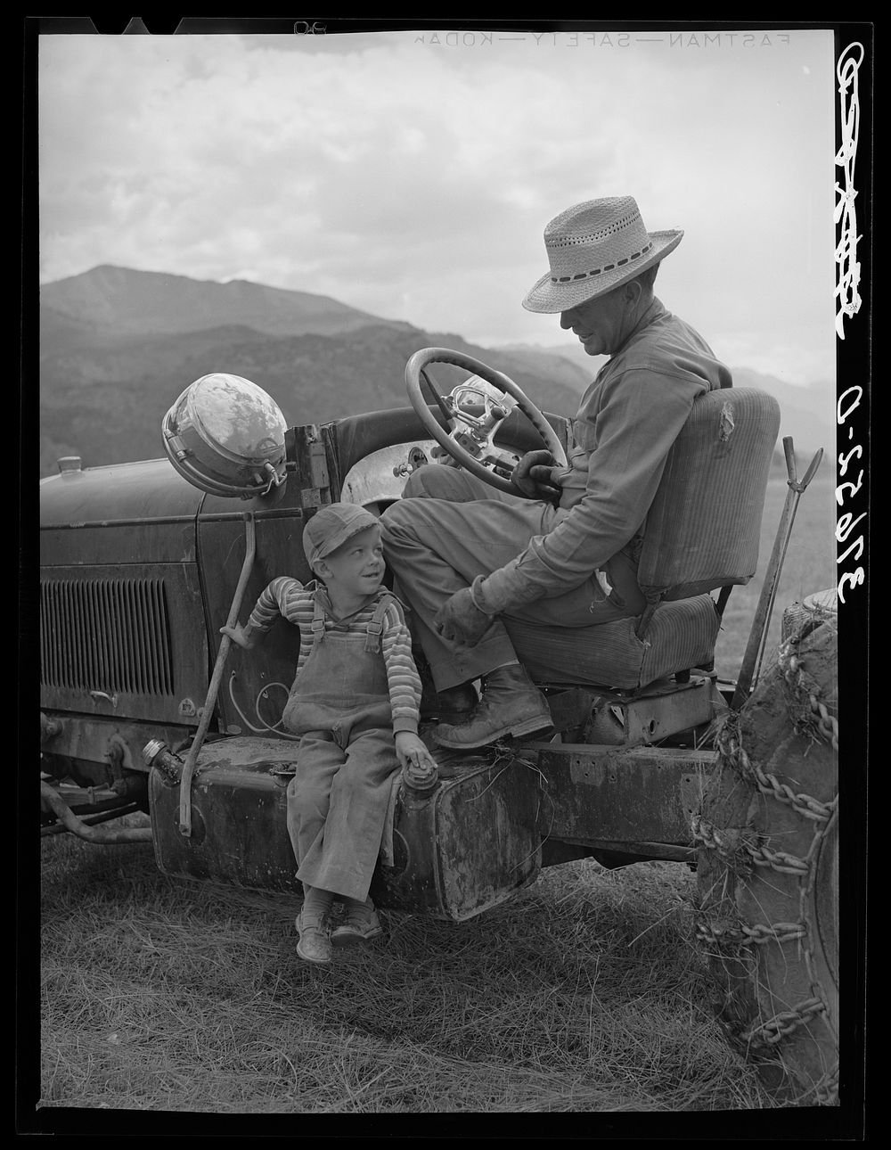 Farmer and his son. Ouray County, Colorado by Russell Lee