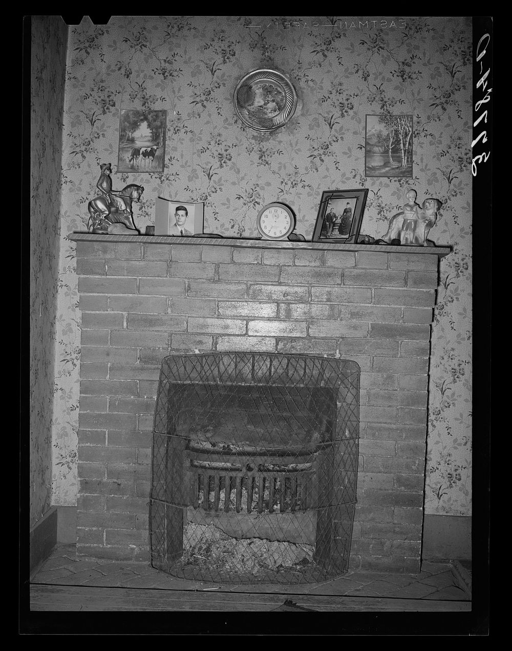 Fireplace in home of farmer living in the Animas River Valley. La Plata County, Colorado by Russell Lee