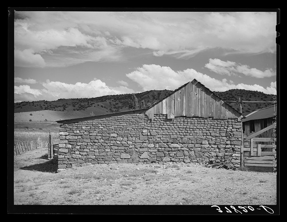 Side of stone barn. Concho, Arizona by Russell Lee