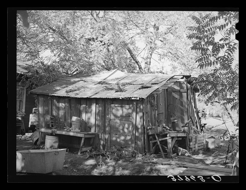 Machine shed of Perry Warner, small farmer and FSA (Farm Security Administration) client of Tehama County, California by…