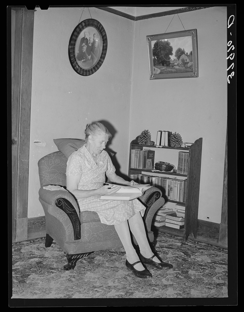Wife of Elof Hansen in living room of her farm home. He is a small farmer in Yuba County, California by Russell Lee