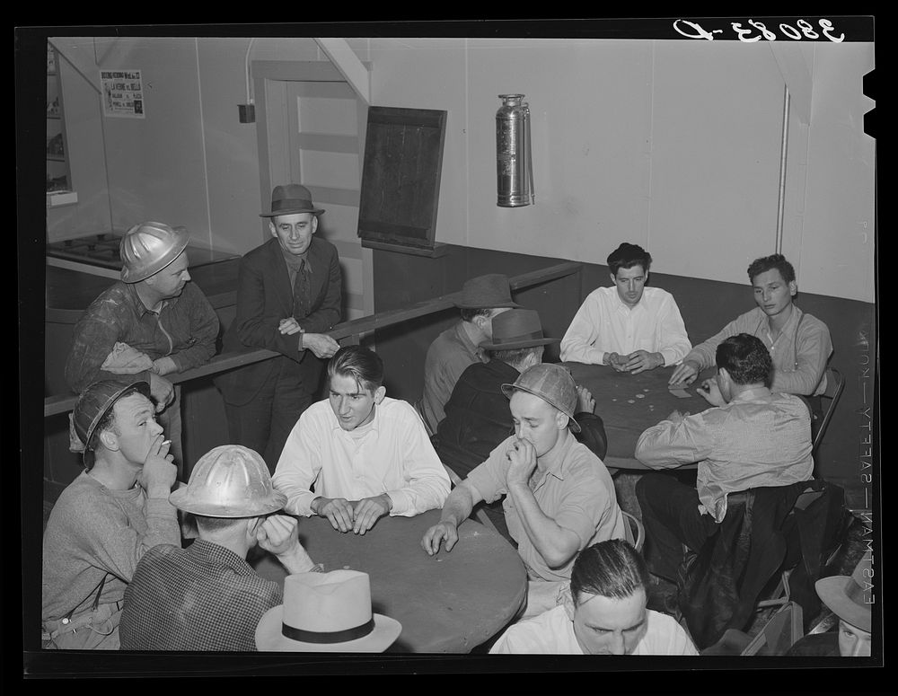 Construction workers at Shasta Dam playing cards at construction canteen. Shasta County, California by Russell Lee
