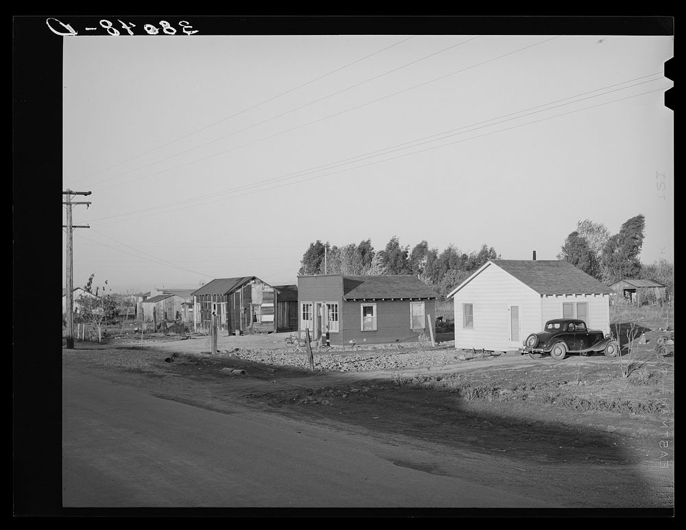 Part of Bull tract near Marysville, California. Houses set on half- and one-acre lots are sold to workers who build their…