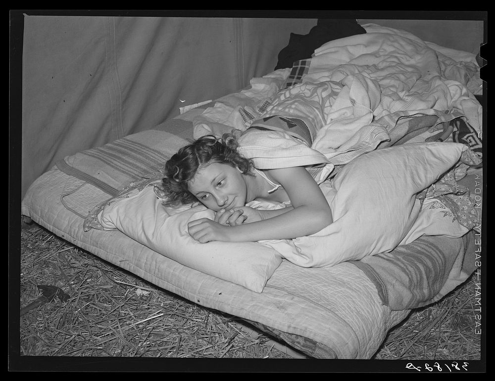 Daughter of carpenter in her tent home. Mission Valley, California, which is about three miles from San Diego. She was in…