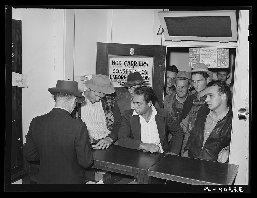 Lineup of workmen at union headquarters, San Diego, California, after the first batch of men are dispatched in the morning.…