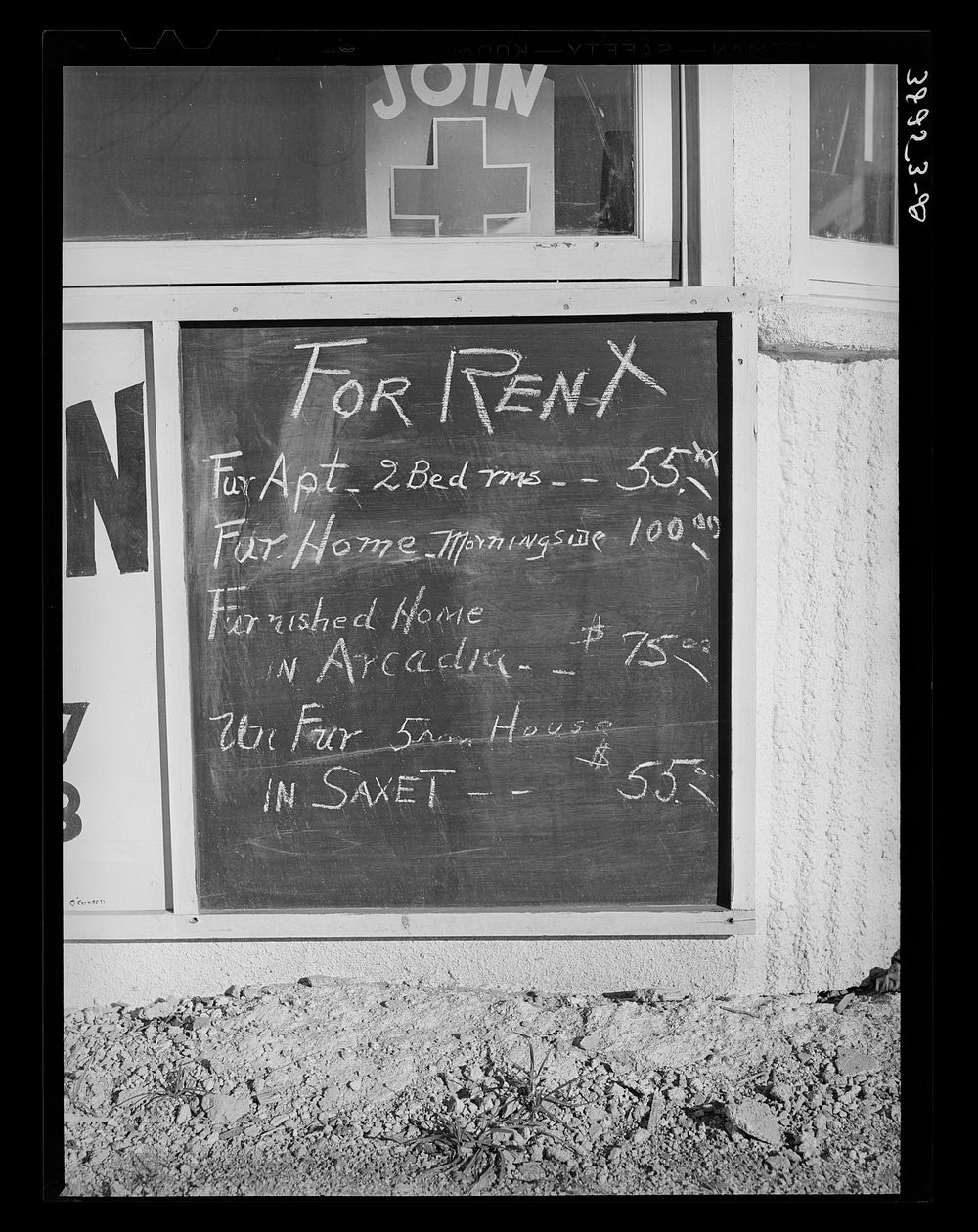 Sign in front of real estate office which shows the rent scale. Corpus Christi, Texas by Russell Lee