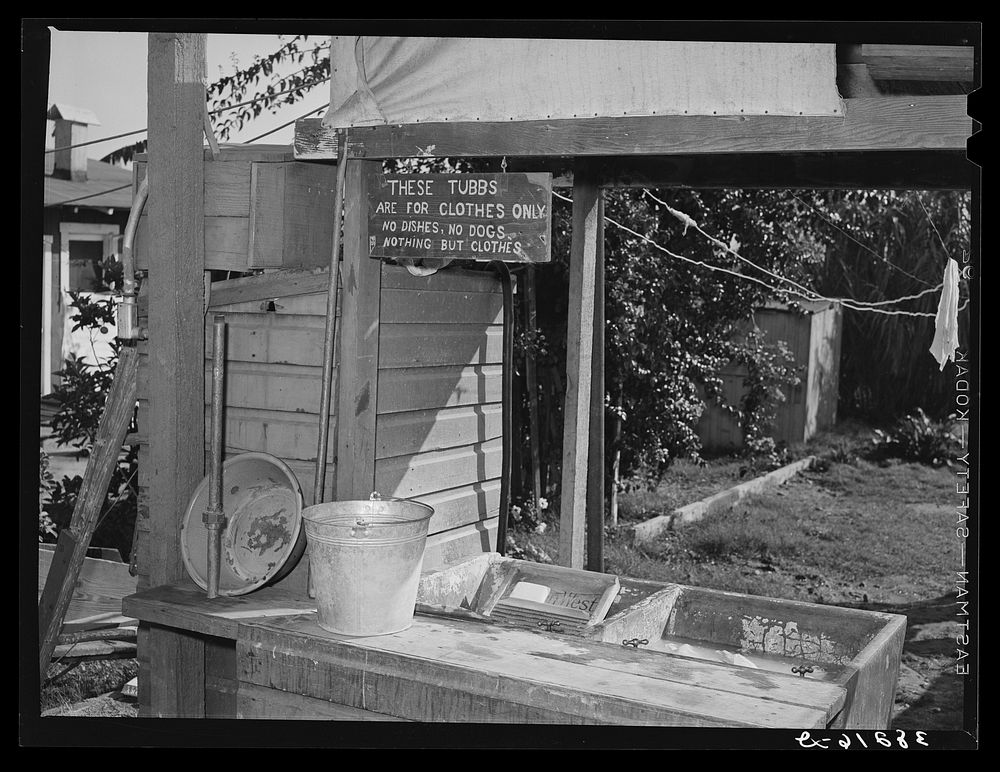 Laundry tubs at trailer court. San Diego, California. It is customary for the owner of the trailer courts to furnish laundry…