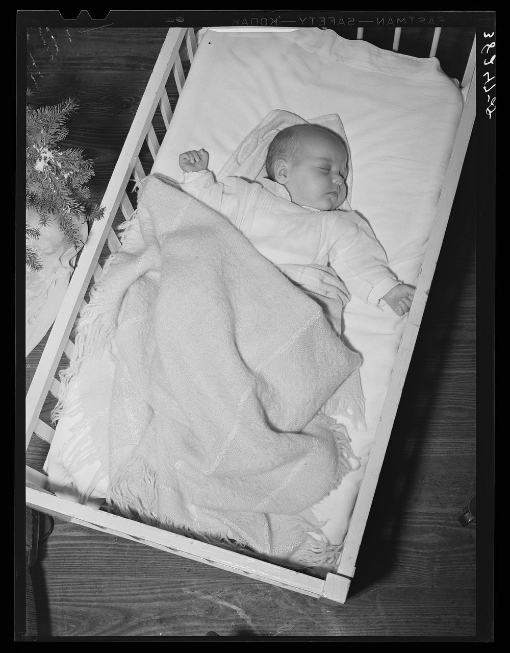 Baby of laborer from northwest Texas who has come to Corpus Christi, Texas, to work at the naval air base by Russell Lee