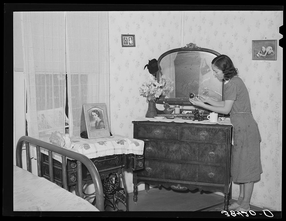 Fruit farmer's wife in bedroom of her house. Placer County, California by Russell Lee