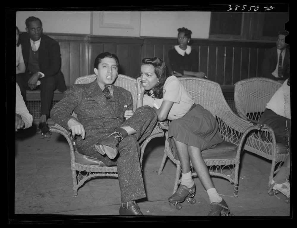 Couple talking at roller skating rink of Savoy Ballroom. Chicago, Illinois by Russell Lee