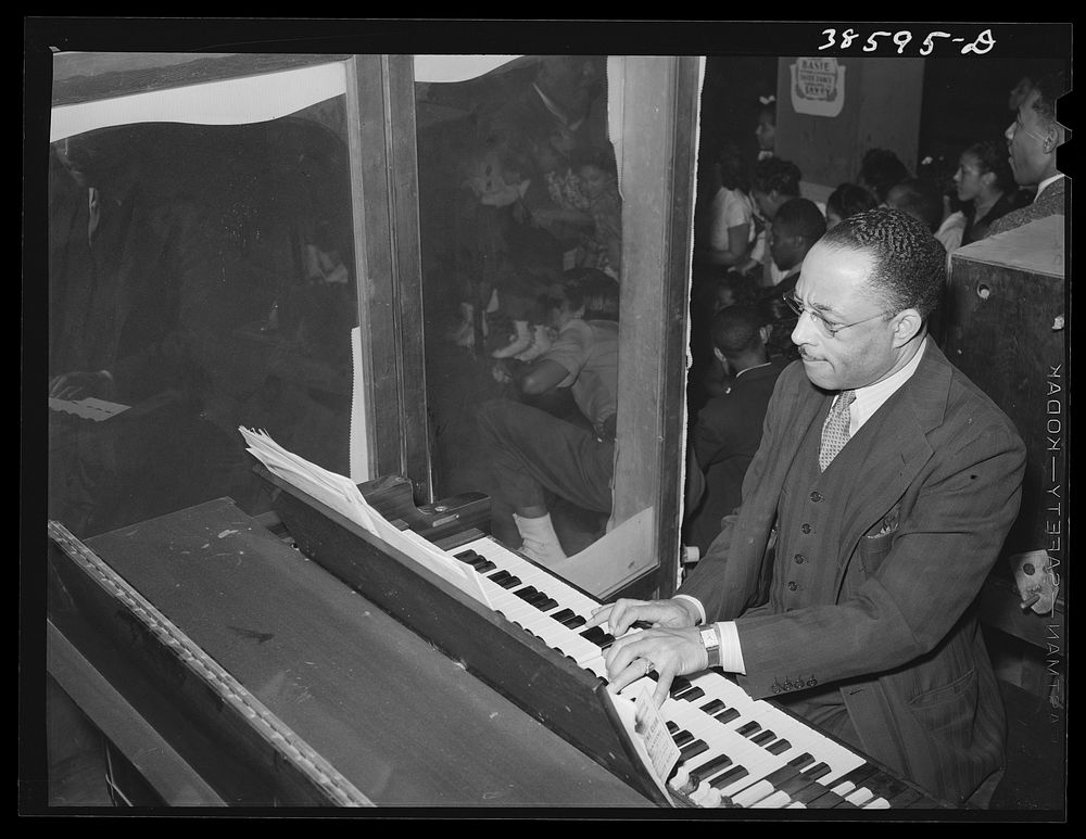 The organist at African American rollerskating rink. Chicago, Illinois by Russell Lee