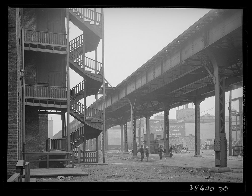 [Untitled photo, possibly related to: Children playing under the elevated on the southside of Chicago, Illinois] by Russell…