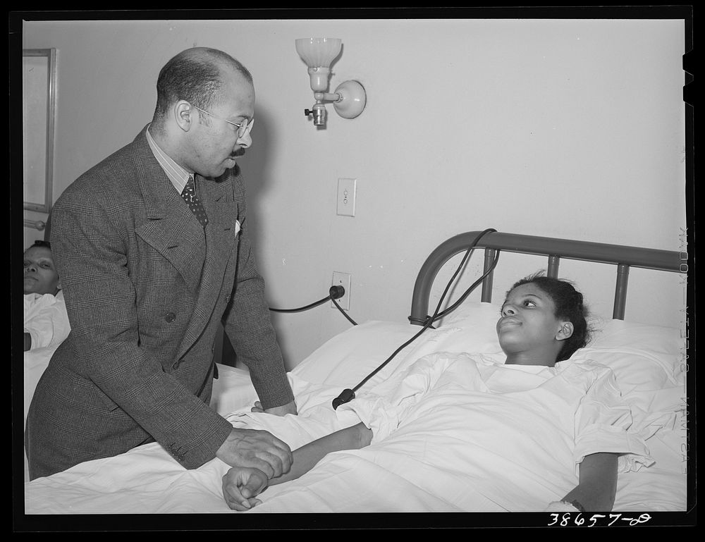 Doctor visiting patient in African American hospital. Chicago, Illinois by Russell Lee