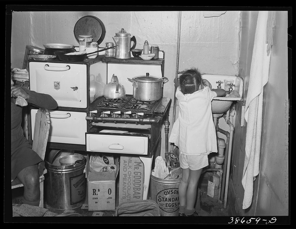 [Untitled photo, possibly related to: Kitchen in crowded  apartment. Chicago, Illinois] by Russell Lee