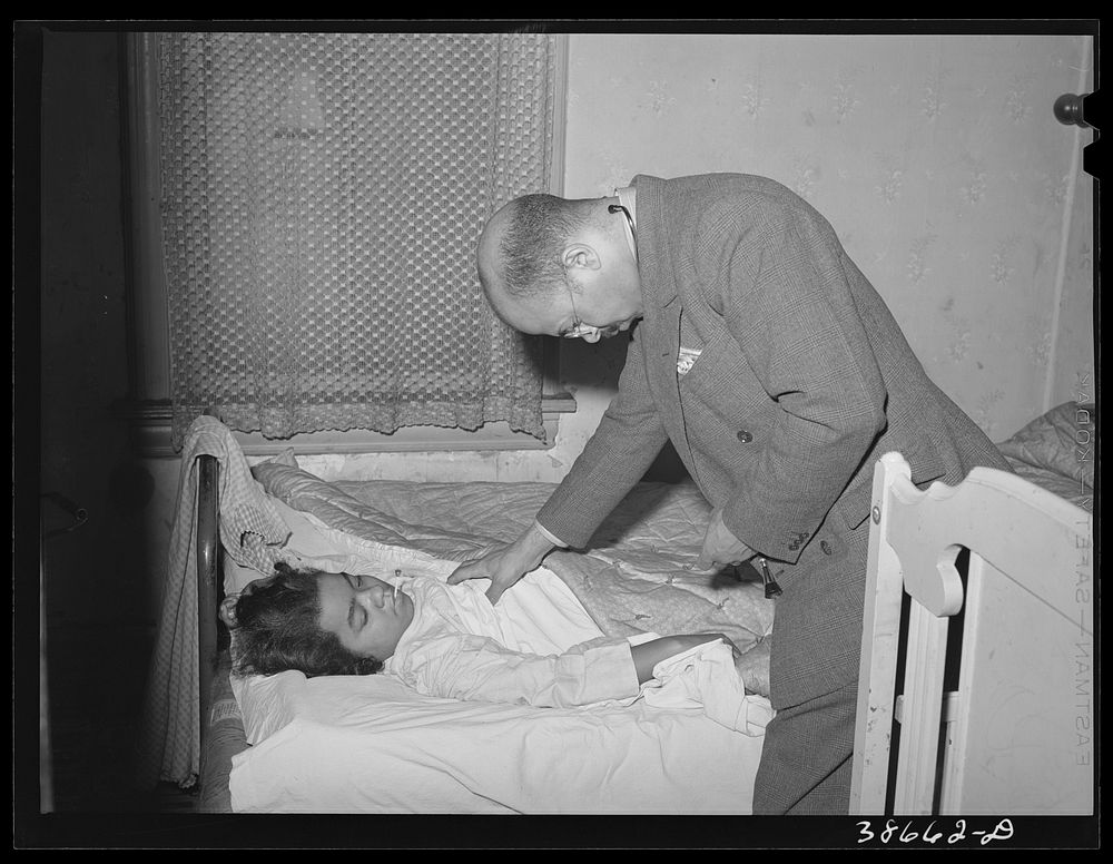 [Untitled photo, possibly related to: Doctor examining patient in her home. Family is on relief. Chicago, Illinois] by…