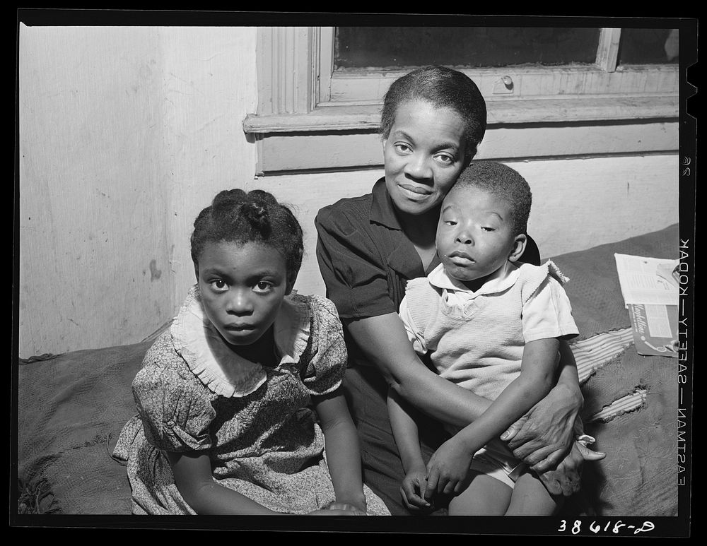 Mother and two children. Family is on relief. Chicago, Illinois by Russell Lee