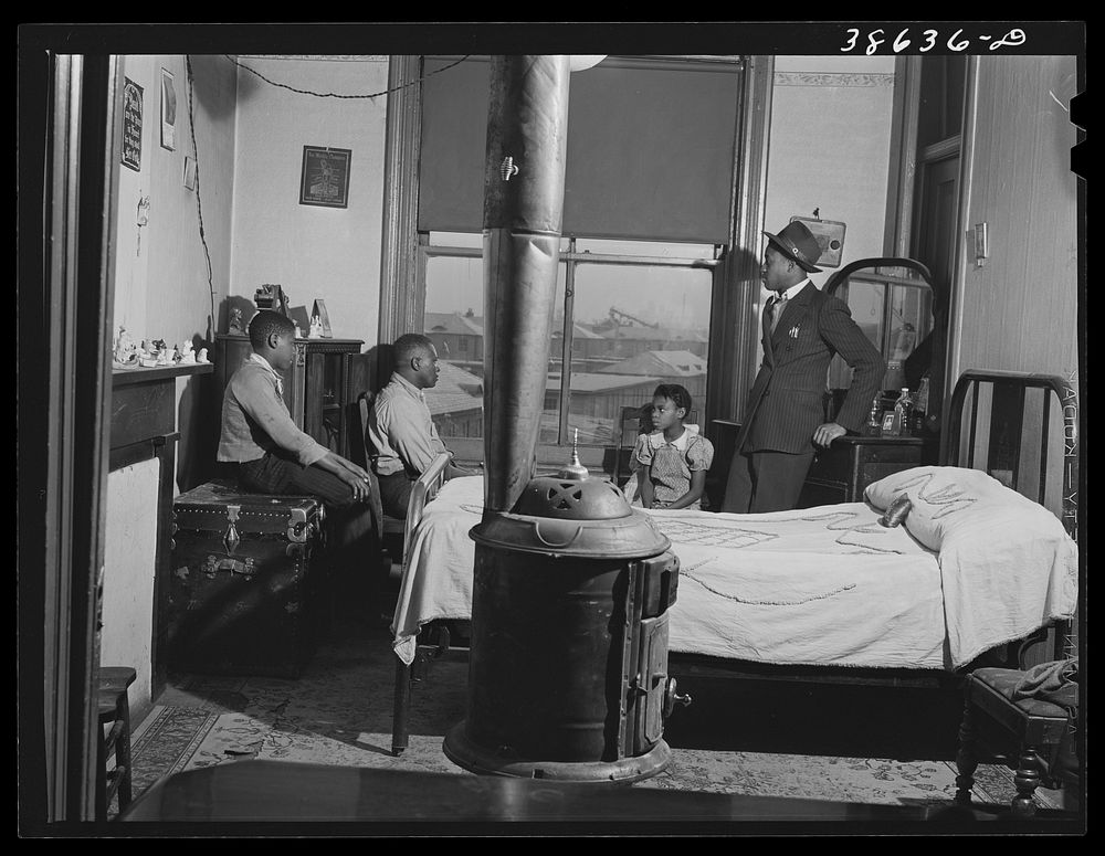 Front room of apartment rented by es. Ida B. Wells Housing Project can be seen through the window. Chicago, Illinois by…