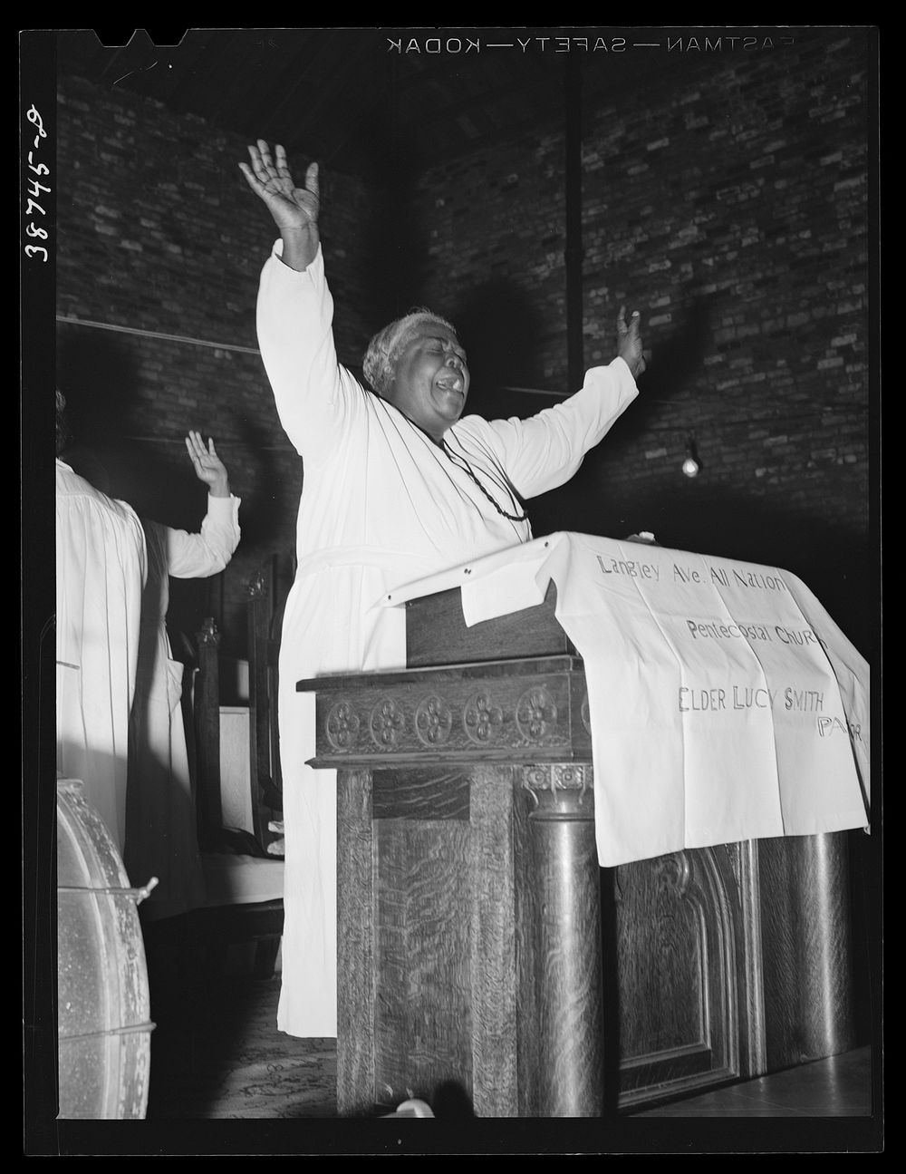 [Untitled photo, possibly related to: Pastor of the Pentecostal church. Chicago, Illinois] by Russell Lee
