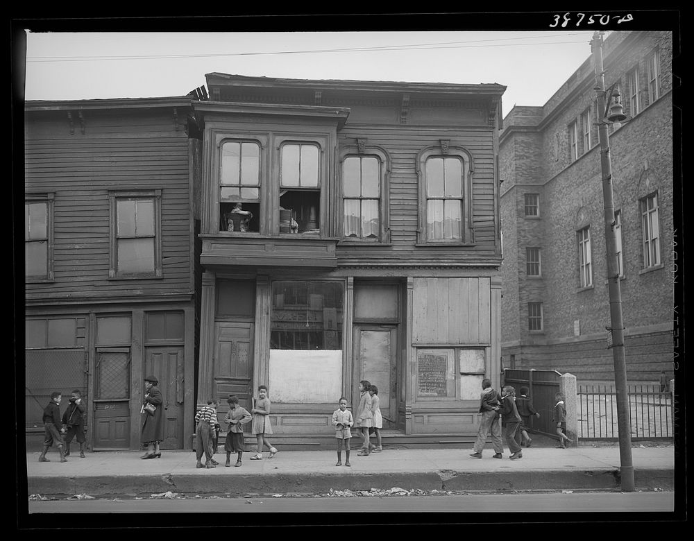 House and children in African American section of Chicago, Illinois by Russell Lee
