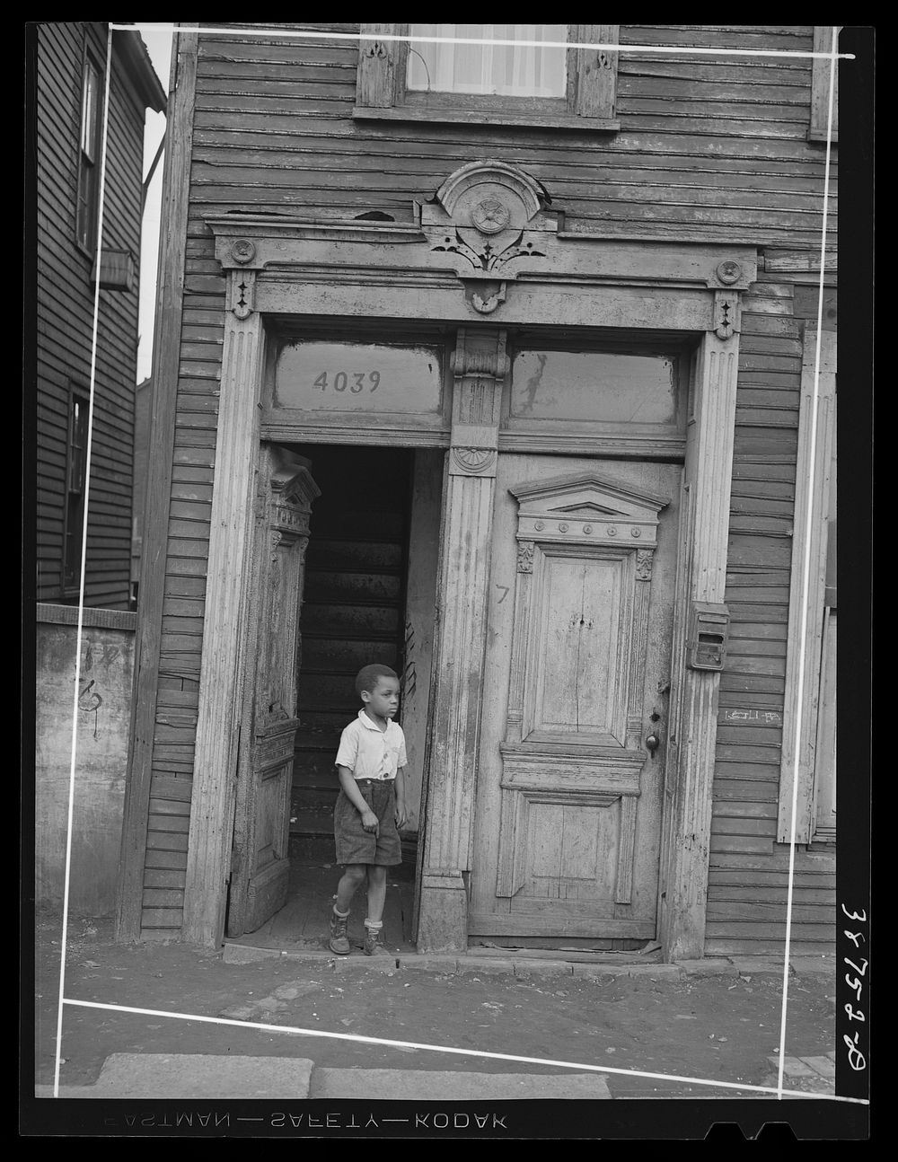 Entrance to house in  section of Chicago, Illinois by Russell Lee