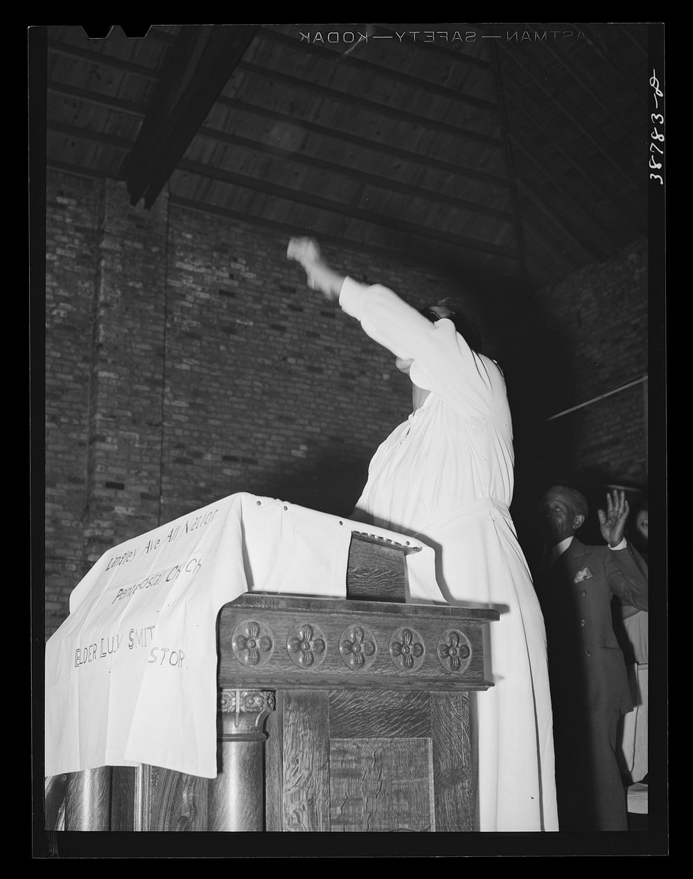 [Untitled photo, possibly related to: One of the leaders talking at the Pentecostal church on the southside of Chicago…