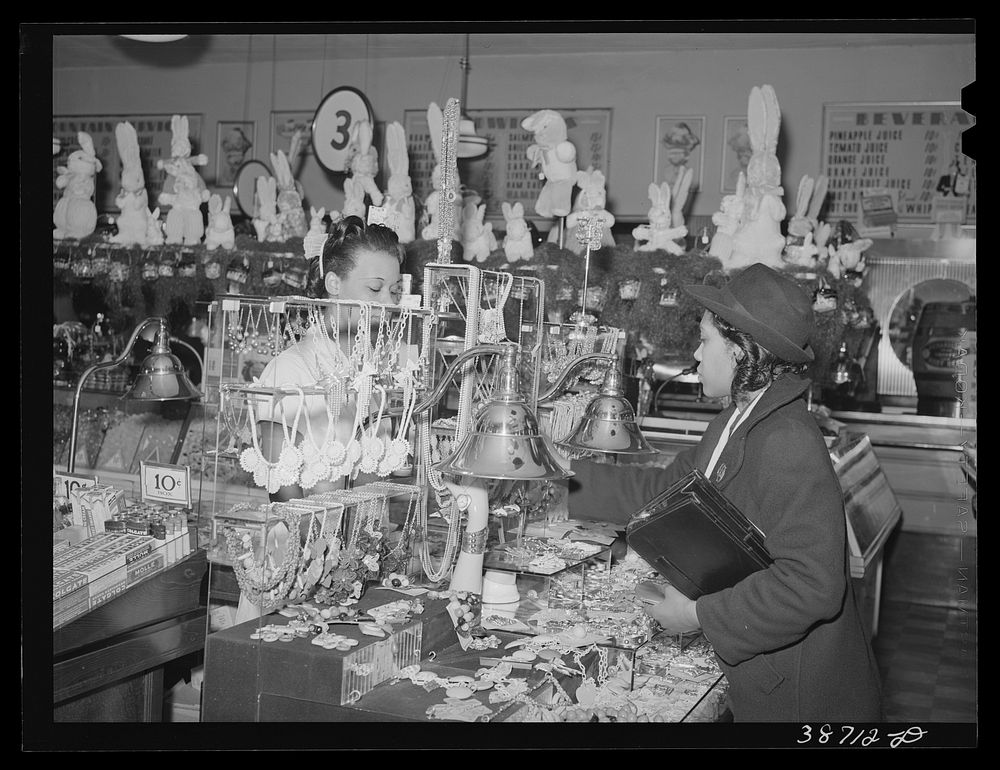 Buying jewelry in ten-cent store which caters to es. Chicago, Illinois by Russell Lee