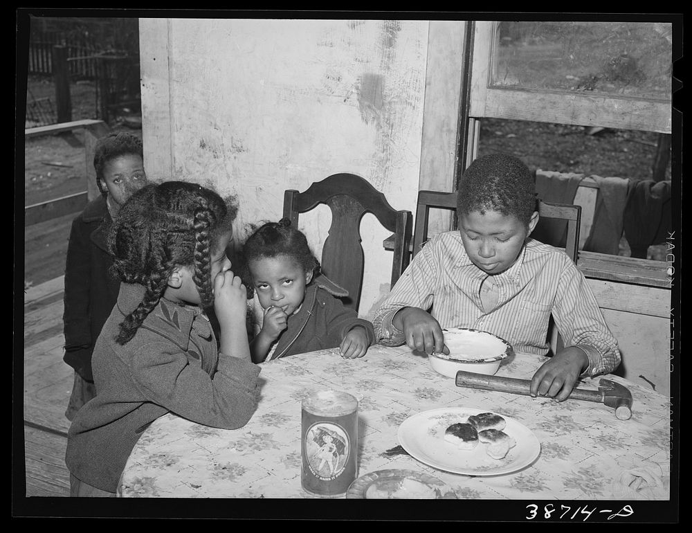  children eating biscuits. Chicago, Illinois by Russell Lee
