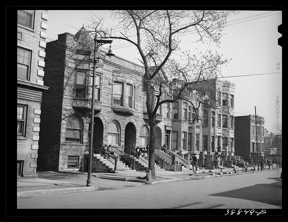 [Untitled photo, possibly related to: Old brownstone houses now occupied by es in Chicago, Illinois] by Russell Lee