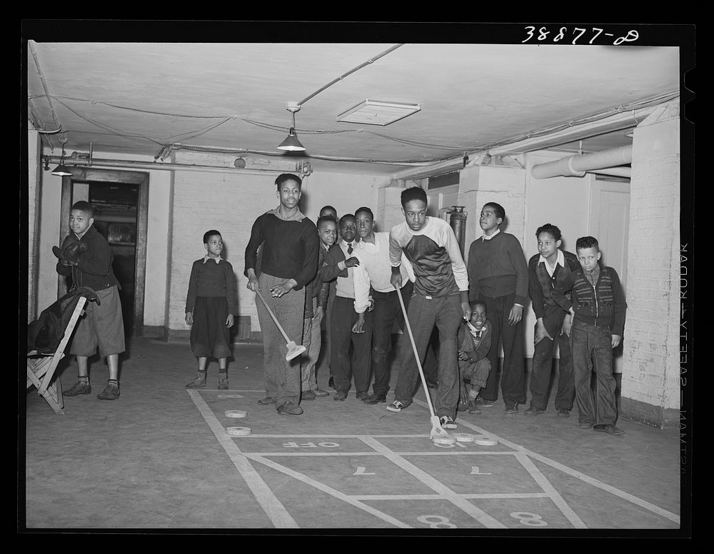 Shuffleboard being played in basement of the Good Shepherd Community Center. Chicago, Illinois by Russell Lee