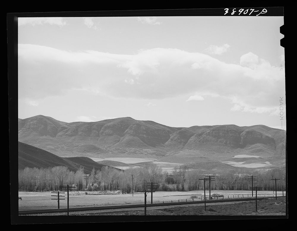 [Untitled photo, possibly related to: Fields extending into the mountains. Henefer, Utah. Mormon farmers in this section not…