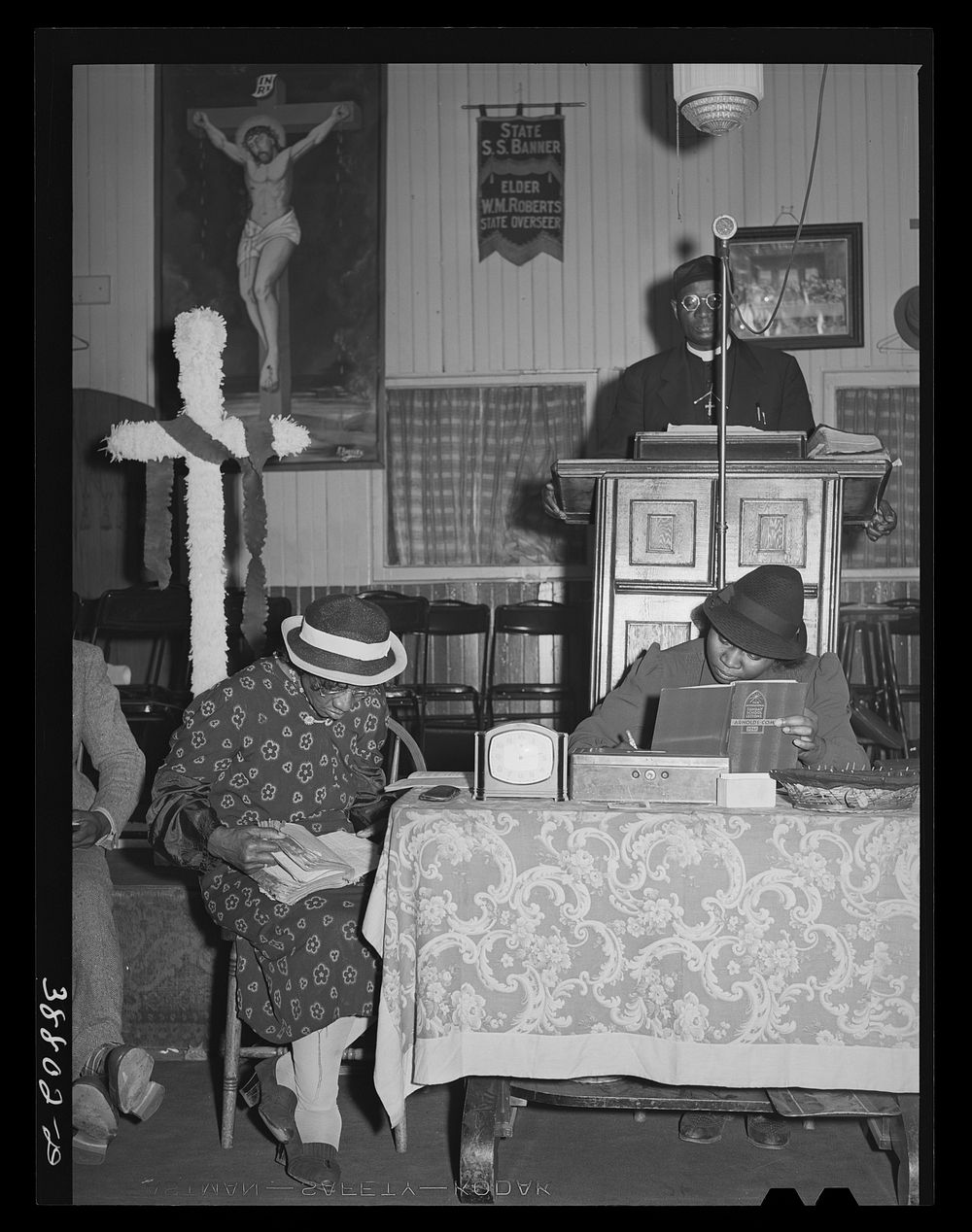 During the services at "storefront" Baptist church on Easter Sunday. Chicago, Illinois by Russell Lee