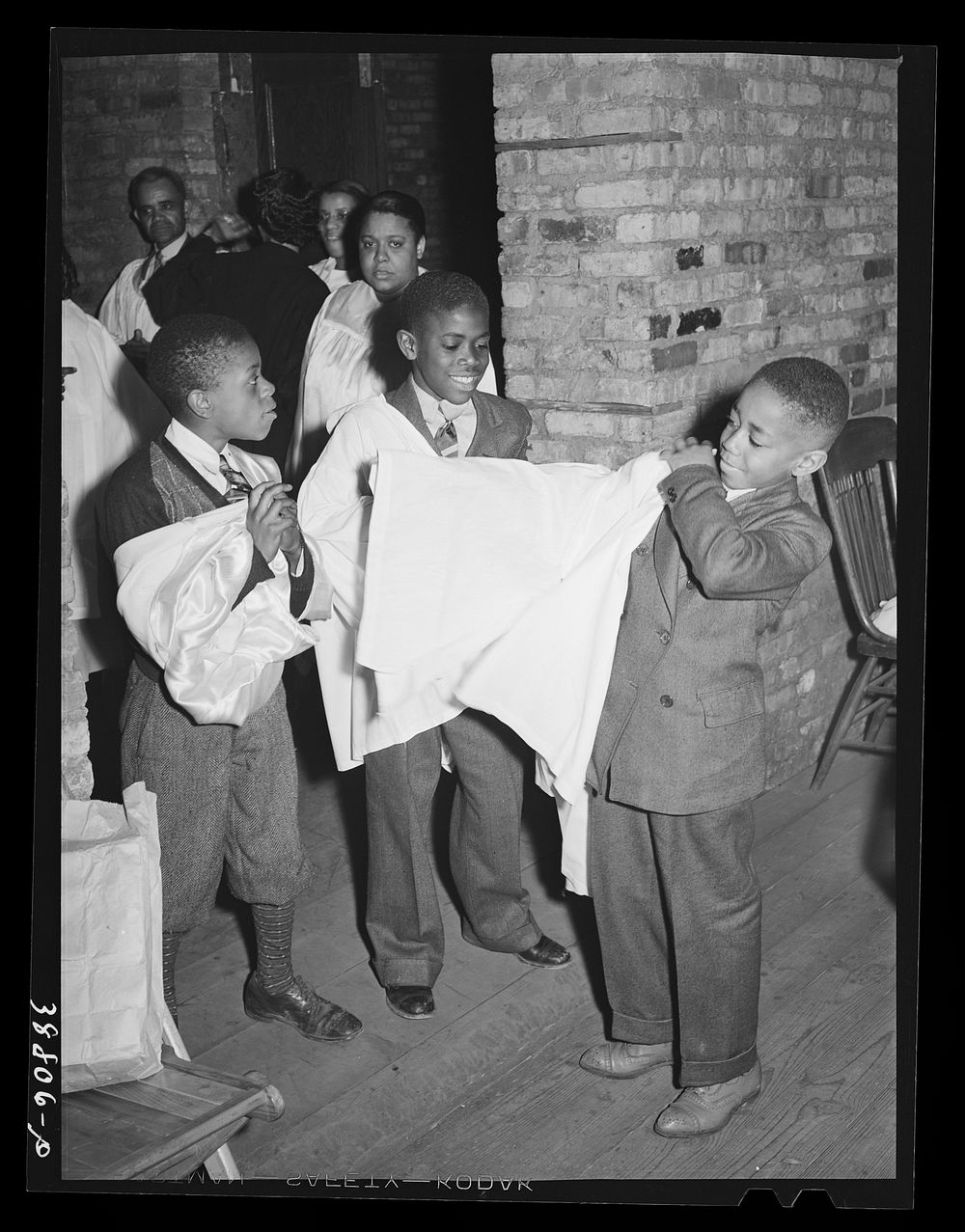 Boys of children's choir putting on their robes. Chicago, Illinois by Russell Lee