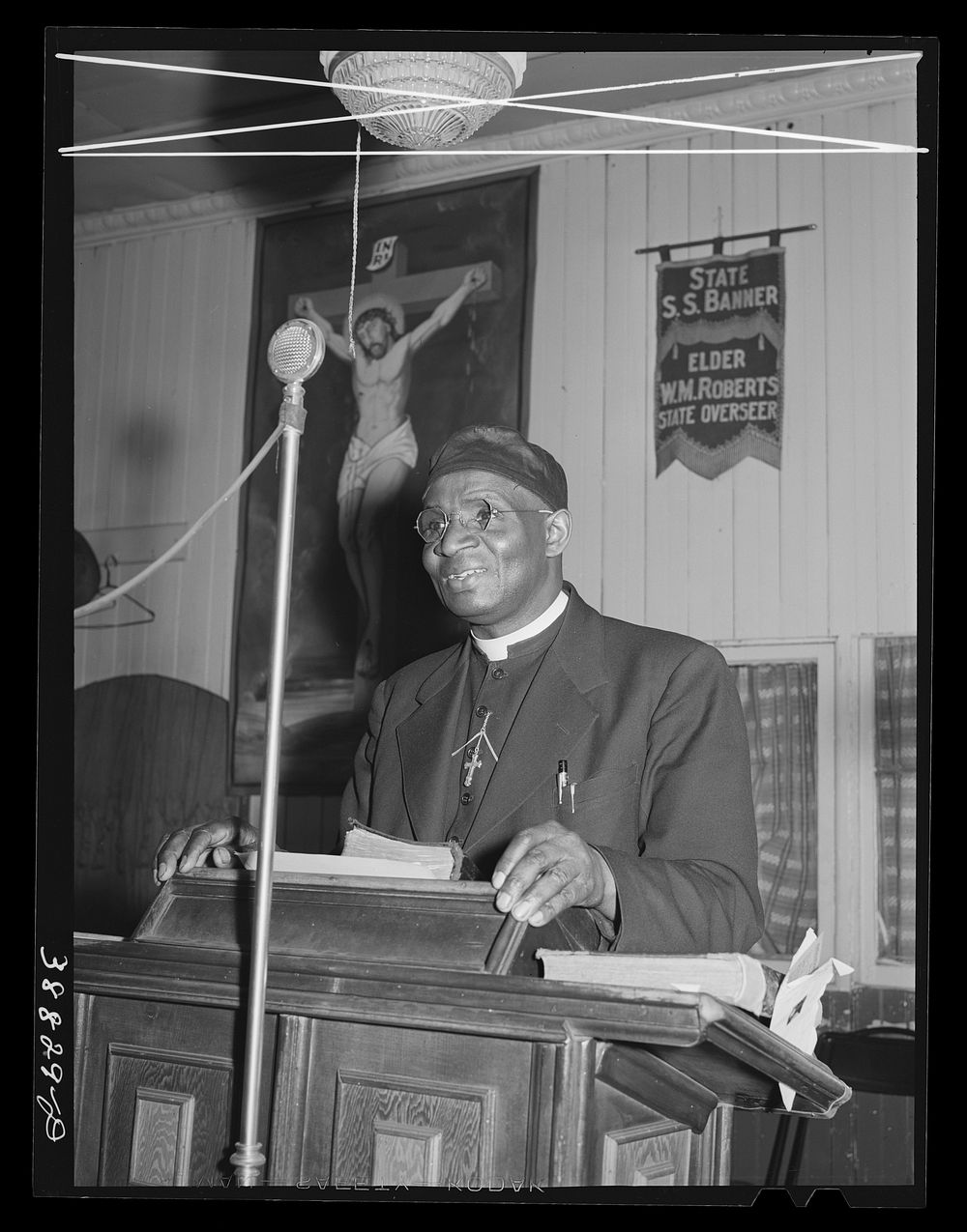 Pastor of the "storefront" Baptist church. Southside of Chicago, Illinois by Russell Lee
