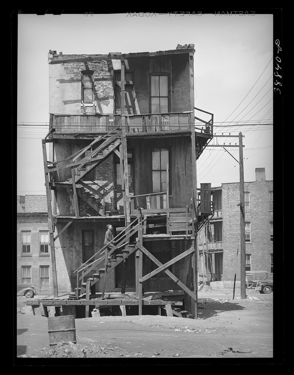 [Untitled photo, possibly related to: Back of multi-family dwellings rented to African Americans. Chicago, Illinois] by…