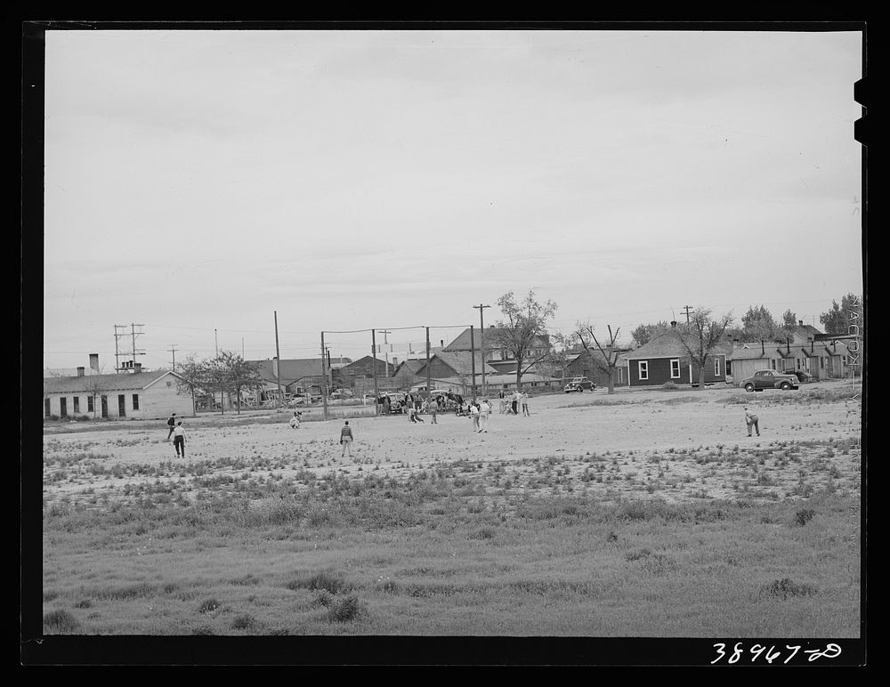 Sandlot baseball game. Twin Falls, Idaho. Twin Falls was settled mostly by people from the middle west when water for…