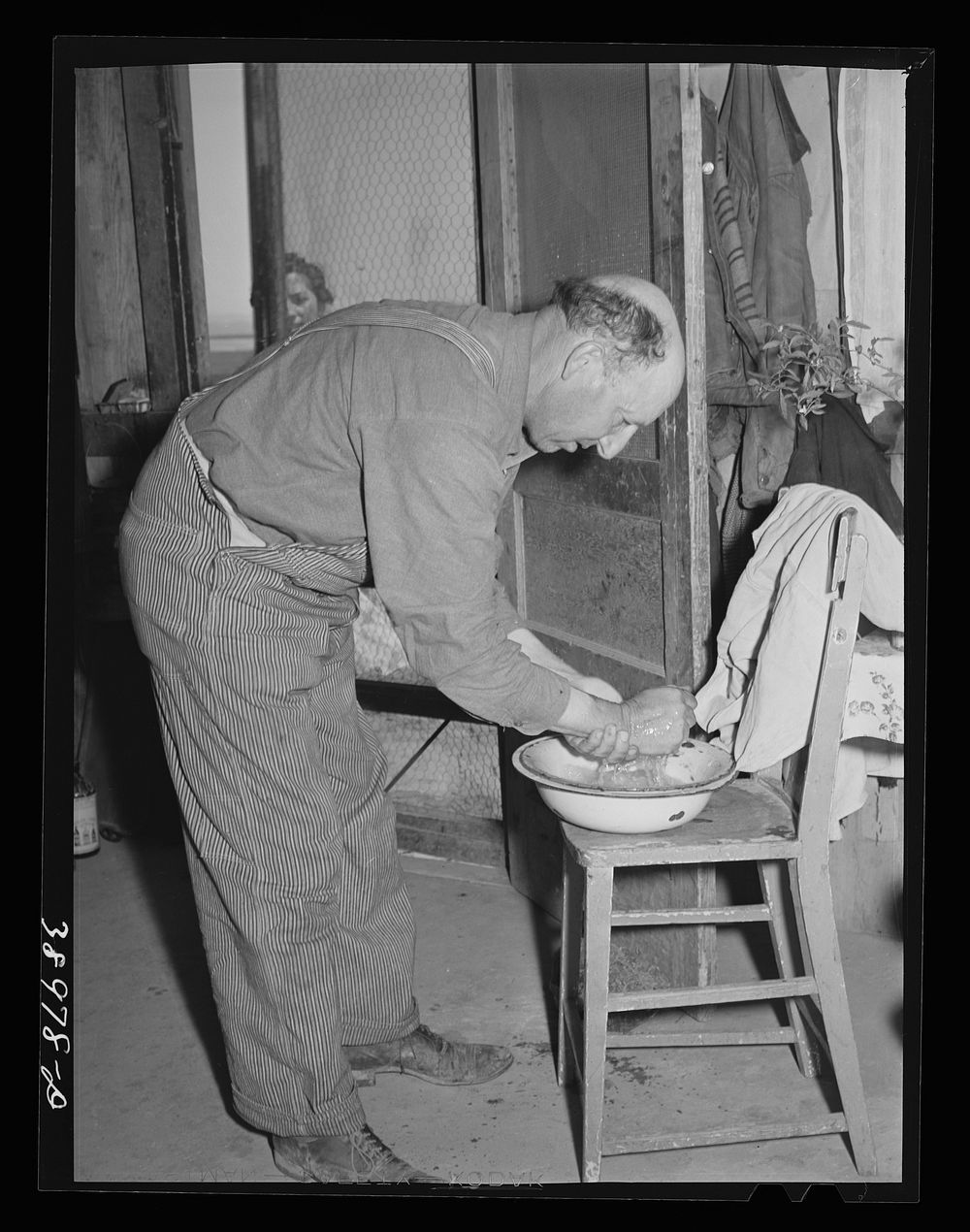 Mr. Browning washes for dinner. He is a (Farm Security Administration) rehabilitation borrower. Dead Ox Flat, Malheur…