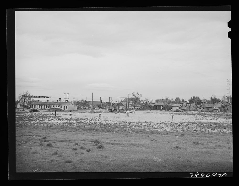[Untitled photo, possibly related to: Sandlot baseball game. Twin Falls, Idaho. Twin Falls was settled mostly by people from…